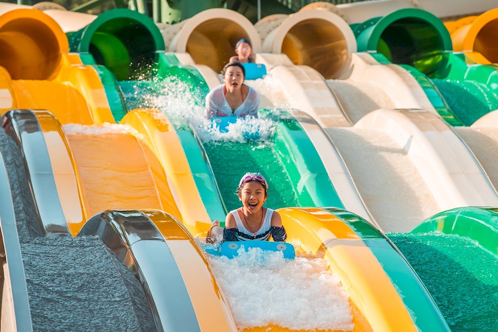 Children are excited by the winding water slides from above